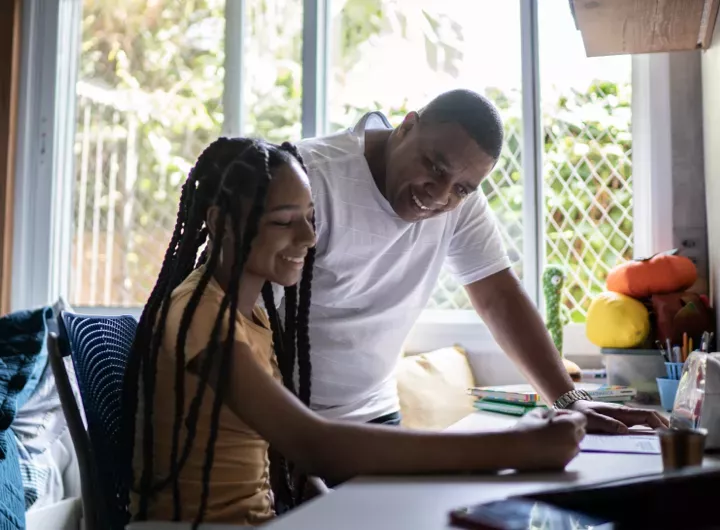 blog_dad_white_shirt_helps_daughter_brown_shirt-with_homework_720x530.webp